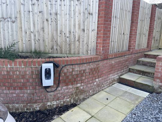 EV charger installed neatly on a brick wall