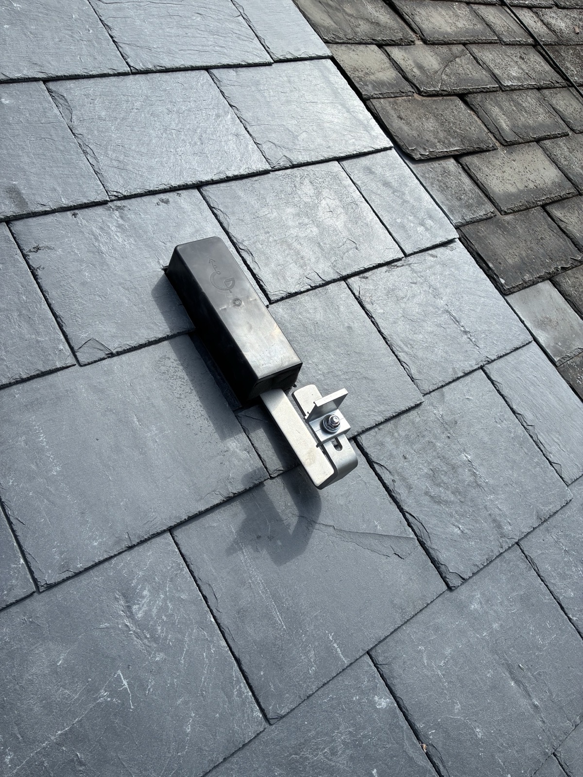 Clenergy solar mounting bracket with Genius slate flashing kit on a slate roof